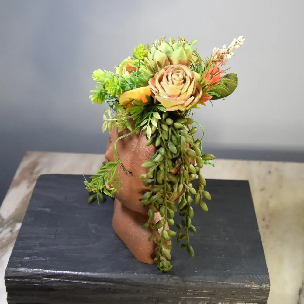 Serene, peaceful airbrushed Sola wood succulents in a fun fabulous face planter